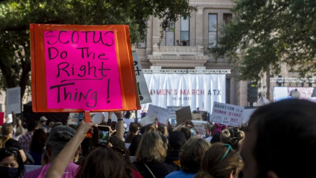 People attend the Women's March ATX rally
