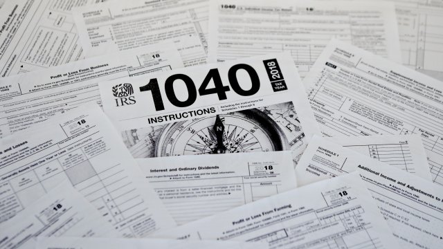Photo shows multiple forms printed from the IRS.