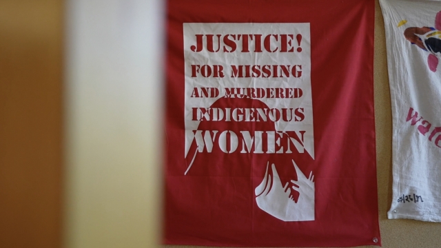 A sign says "justice for missing and murdered indigenous women."