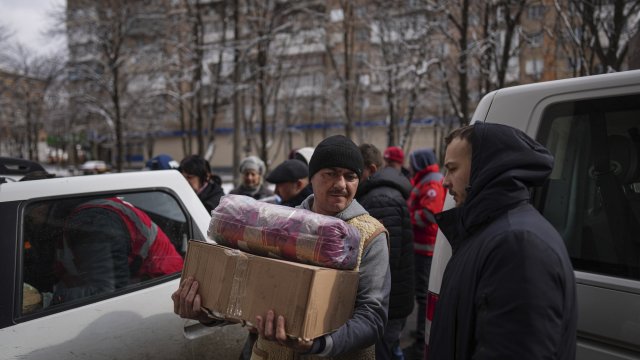 People receive aid supplies in Mariupol, Ukraine