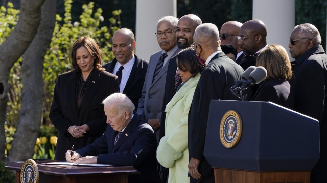 President Joe Biden signs the Emmett Till Anti-Lynching Act in the Rose Garden