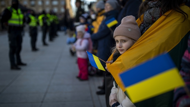 A girl holds the Ukrainian flag during a celebration of Lithuania's independence.