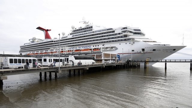 Passengers disembark from the Carnival Sunshine cruise ship