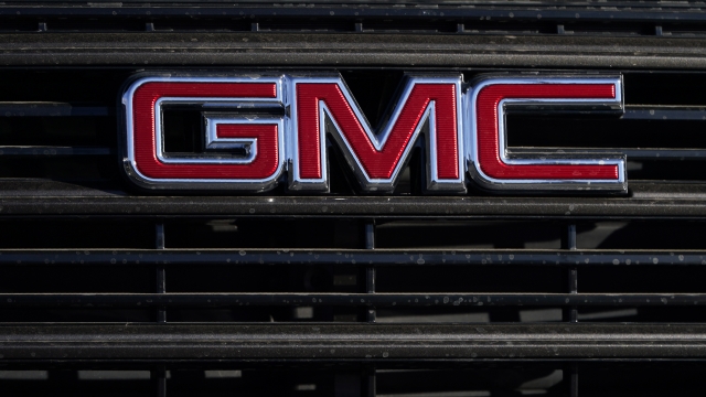 A GMC company logo is displayed at a GMC Truck dealership