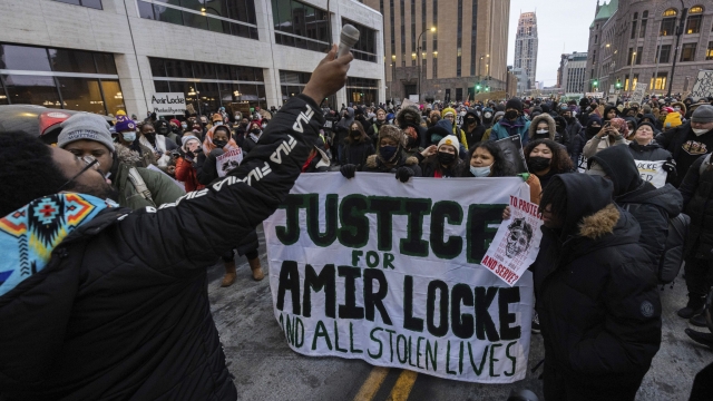 People march at a rally for Amir Locke in February.