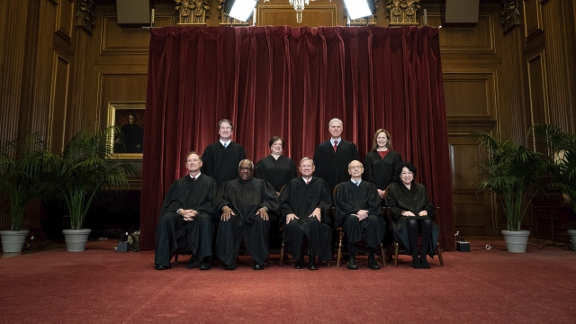 Members of the Supreme Court pose for a group photo