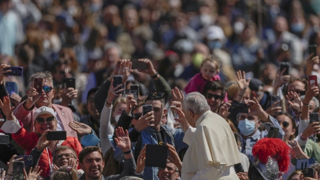 Pope Francis in a crowd after finishing Easter Mass