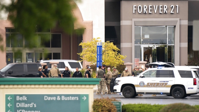 Members of law enforcement gather outside Columbiana Centre mall.