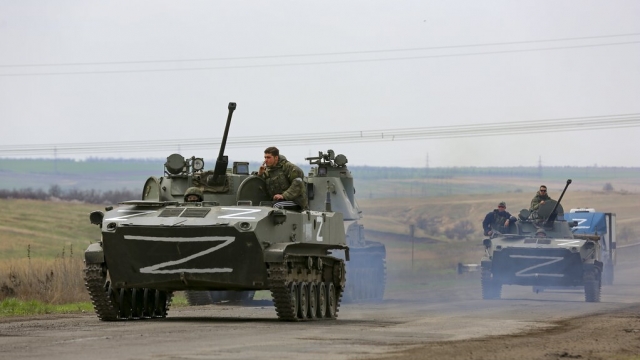 Russian military vehicles move on a highway in Mariupol, Ukraine.