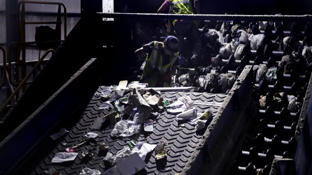 Workers at a recycling plant