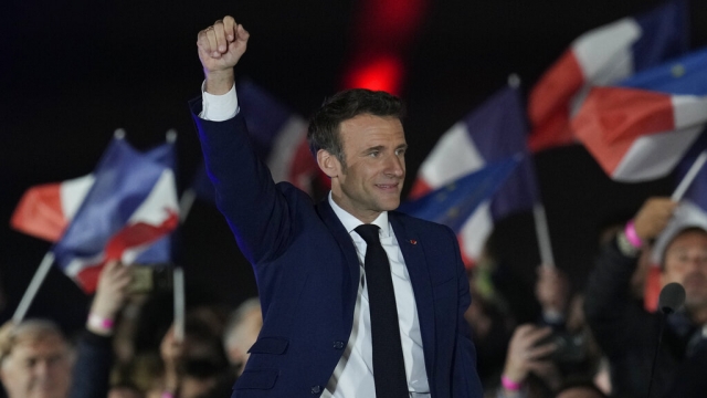 French President Emmanuel Macron celebrates with supporters in Paris, France.