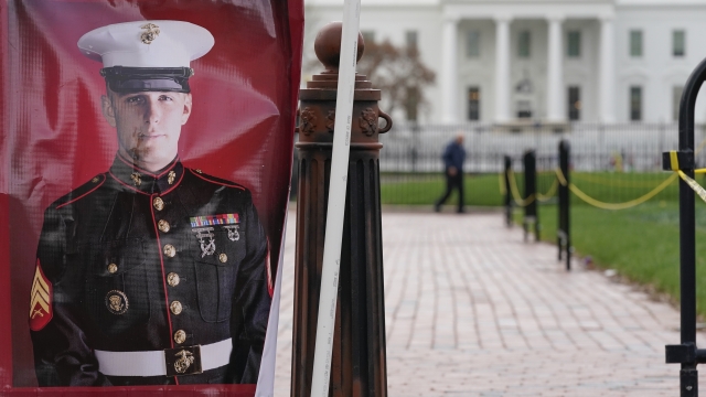 A poster photo of U.S. Marine Corps veteran and Russian prisoner Trevor Reed stands in Lafayette Park near the White House