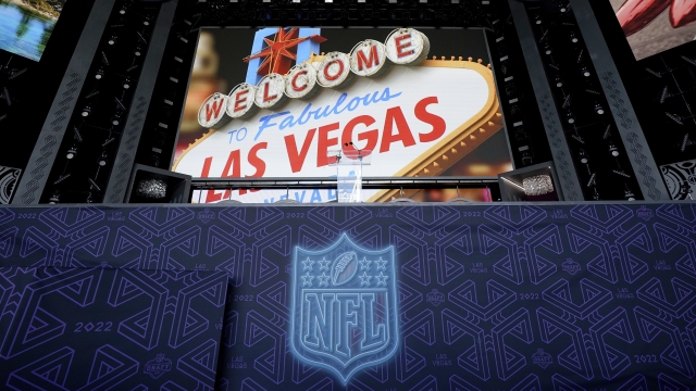 The NFL logo is seen below an image of the Welcome to Las Vegas sign