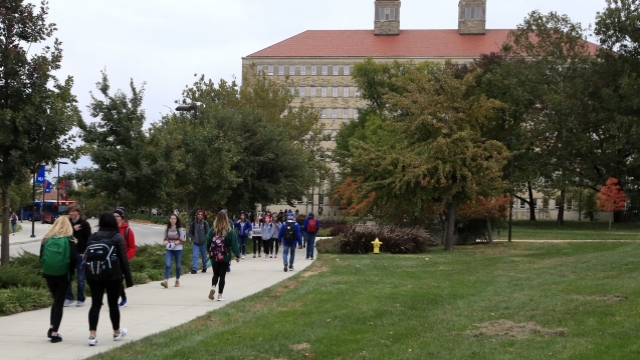 Students walking at University of Kansas campus.