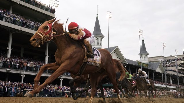 Rich Strike (21), with Sonny Leon aboard, wins the 148th running of the Kentucky Derby horse race.