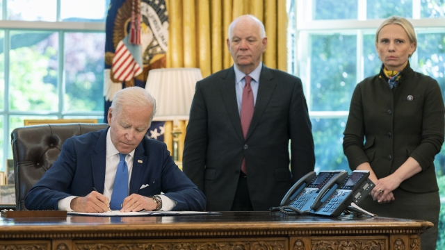 President Joe Biden signs the Ukraine Democracy Defense Lend-Lease Act of 2022.