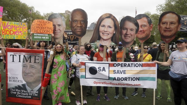 Protesters hold up signs during an abortion rights demonstration in New York