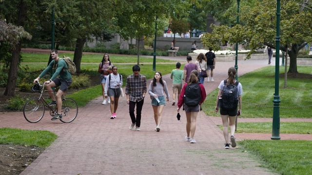 Students walk to and from classes on the Indiana University campus.