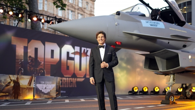 Tom Cruise poses for the media during the 'Top Gun Maverick' UK premiere.
