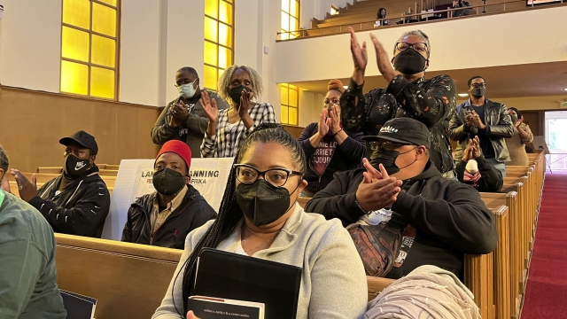 People attend a reparations task force meeting
