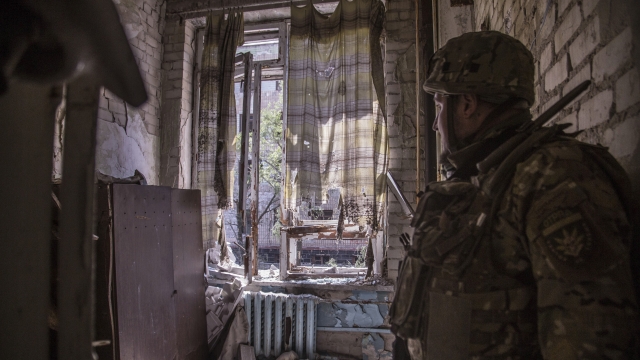A Ukrainian soldier stands in a position during heavy fighting on the front line in Severodonetsk.