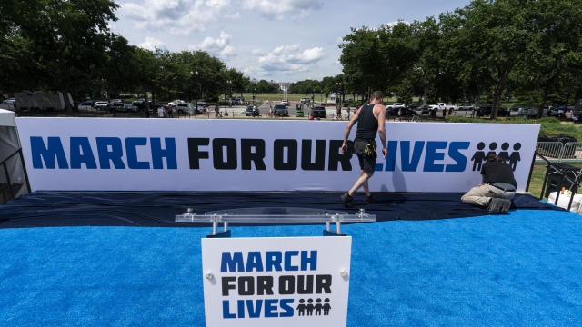 Workers set up for the March for Our Lives rally on the National Mall