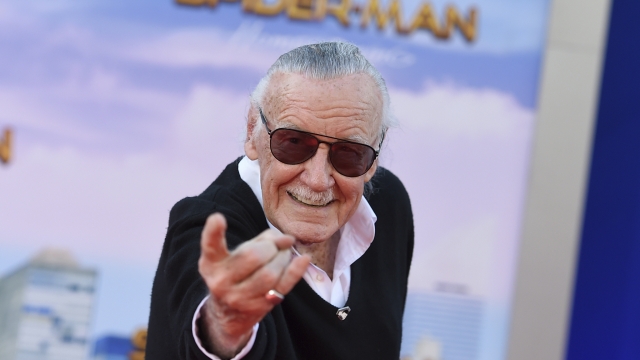Stan Lee is shown at a movie premiere.