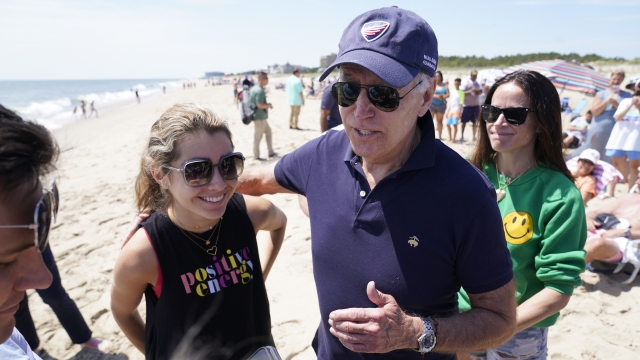 President Joe Biden talks to the media after walking on the beach with his granddaughter Natalie Biden