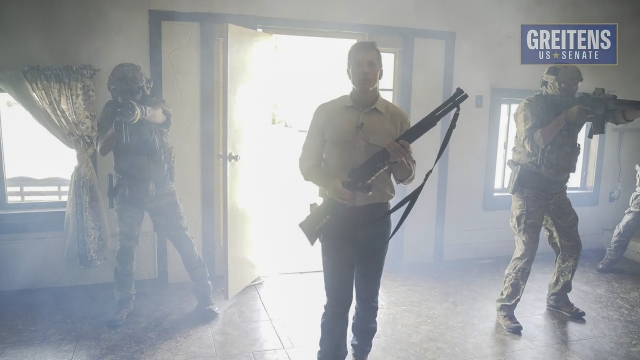 The image from video from a campaign ad by Eric Greitens for U.S. Senate shows him brandishing a long gun.