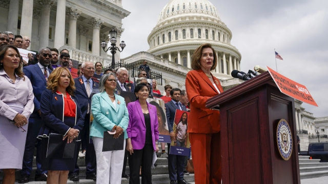 House Speaker Nancy Pelosi of Calif., with other lawmakers, speaks about the gun violence bill at the Capitol in Washington.
