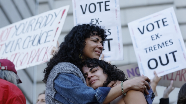 A mother and daughter hug during an abortion-rights protest