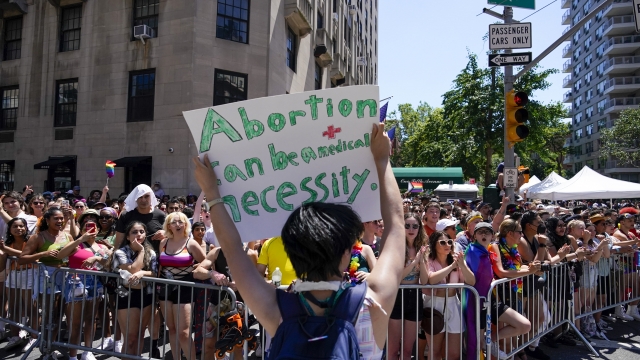 A protestor holds a sign in support of abortion rights.