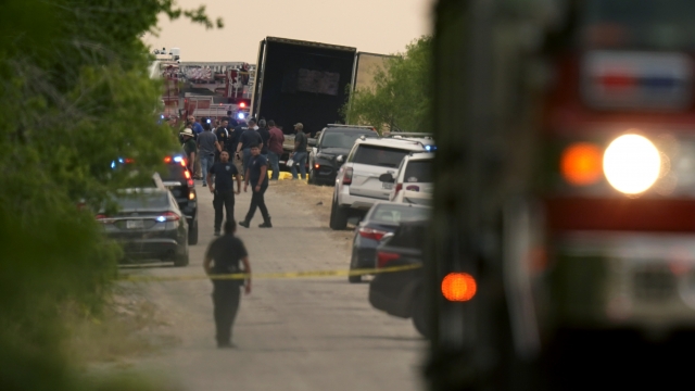 A tractor trailer on a remote Texas road where the bodies of 46 migrants were discovered