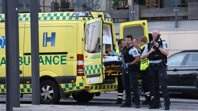 An ambulance and armed police outside the Field's shopping center, in Orestad, Copenhagen, Denmark.