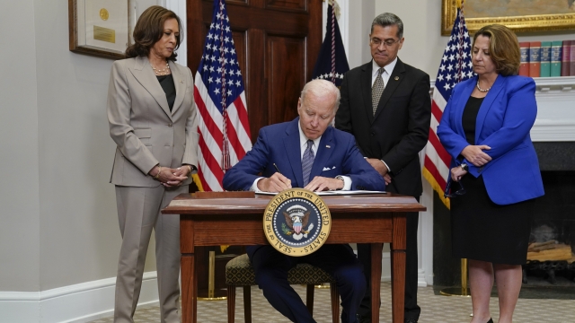 U.S. President Joe Biden signs an executive order.