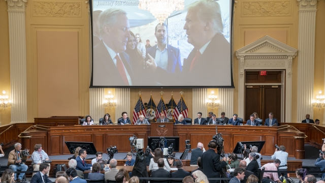 Image of former President Donald Trump talking to his chief of staff Mark Meadows is displayed on a screen during a hearing