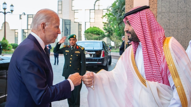 Saudi Crown Prince Mohammed bin Salman, right, greets President Joe Biden with a fist bump