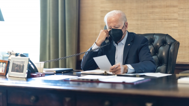President Joe Biden talks on the phone with his national security team.
