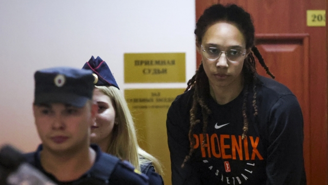 WNBA star and two-time Olympic gold medalist Brittney Griner is escorted to a courtroom for a hearing.