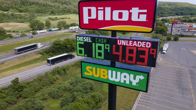 A sign shows gas prices