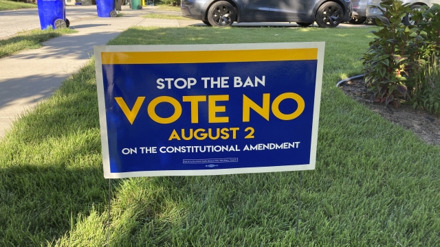 a sign in a yard in Merriam, Kansas, urges voters to oppose a proposed amendment to the Kansas Constitution