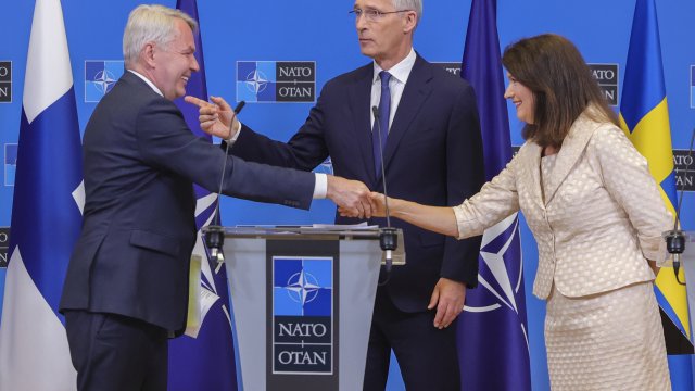 Finland's Foreign Minister Pekka Haavisto, Sweden's Foreign Minister Ann Linde and NATO Secretary General Jens Stoltenberg