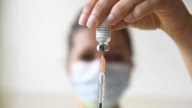 A health professional prepares a dose of a Monkeypox vaccine.