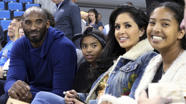 Los Angeles Lakers legend Kobe Bryant, his daughter Gianna, wife Vanessa and daughter Natalia are seen at a game.