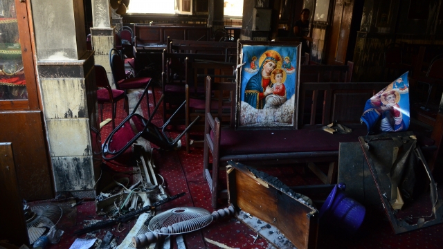 Burned furniture and religious images are seen at the site of a fire inside the Abu Sefein Coptic church.