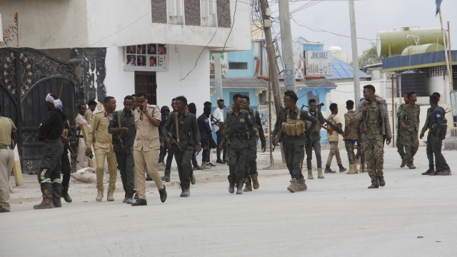 Soldiers patrol outside the Hayat Hotel in Mogadishu, Somalia.