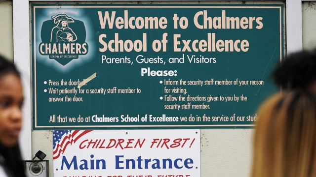 Signs are seen at the entrance of Chalmers Elementary school in Chicago