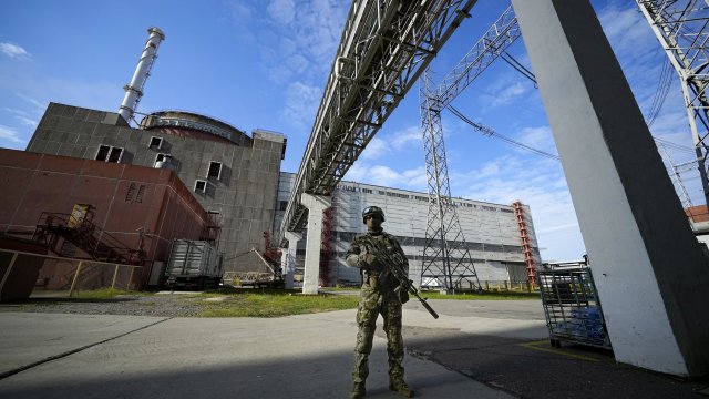 A Russian serviceman guards a nuclear power station.