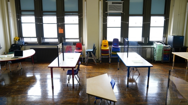 Desks are spaced apart at an elementary school