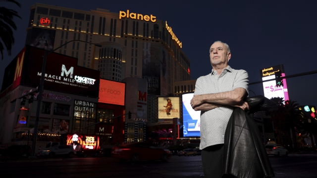 Jeff German, host of "Mobbed Up," poses with Planet Hollywood in the background on the Strip in Las Vegas.